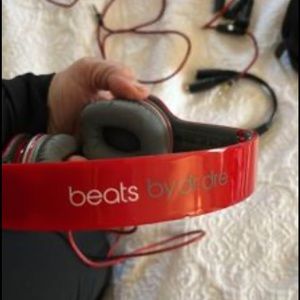 Beats by Dr Dre red headphones. Take them with you in a matching case